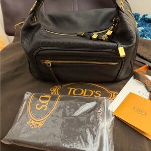 Tod's Elegant Black Leather Shoulder Bag with Gold Accents
